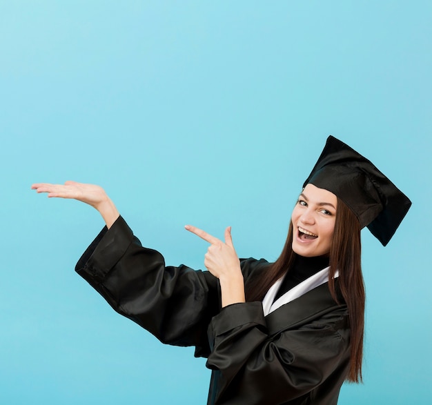 Girl in academic suit smiling