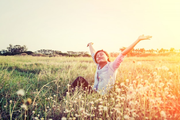 Free photo girl enjoying a field of flowers