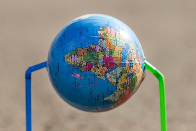 Free photo globe with plastic straws