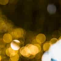 Free photo golden blurred bokeh background