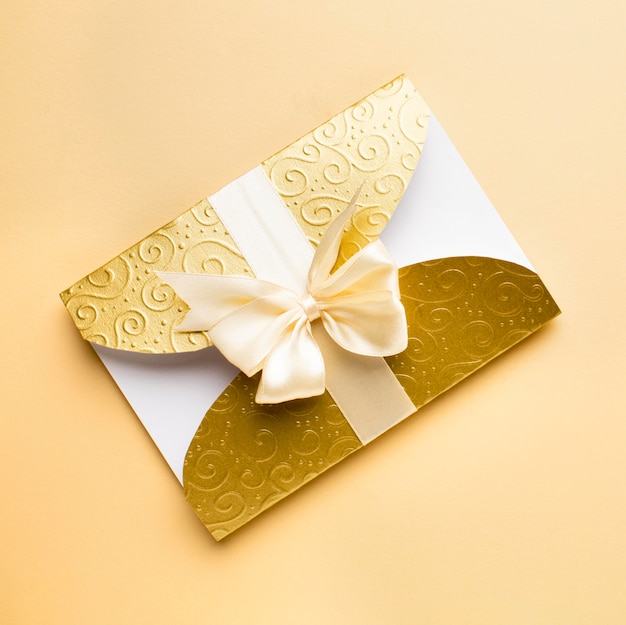 Free photo golden envelope luxury wedding stationery