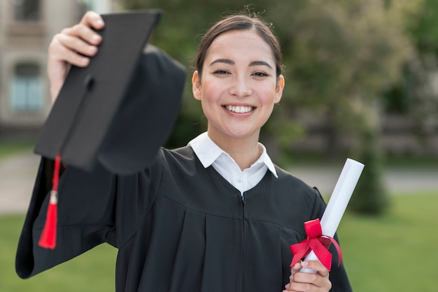 Graduation concept with portrait of happy girl