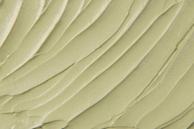 Free photo green cake frosting texture background close-up