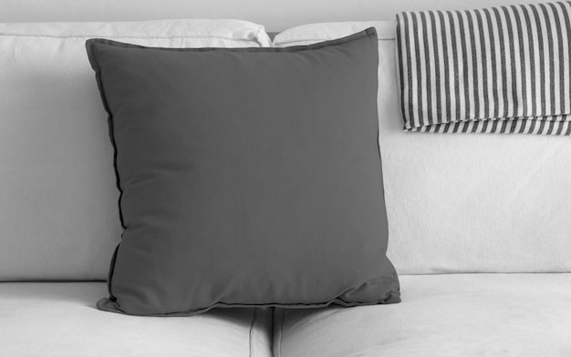 Free photo grey pillow over white sofa