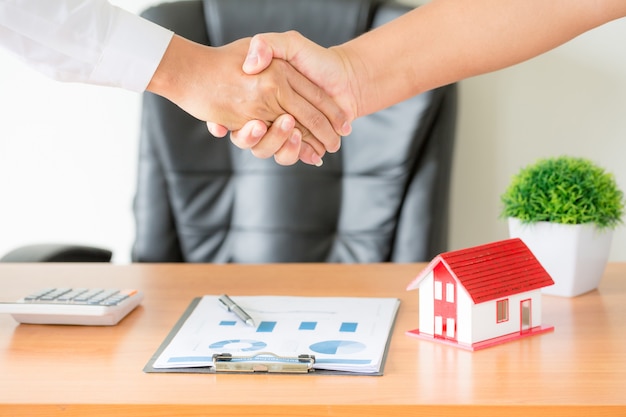 Free photo hands of agent and client shaking hands after signed contract buy new apartment.