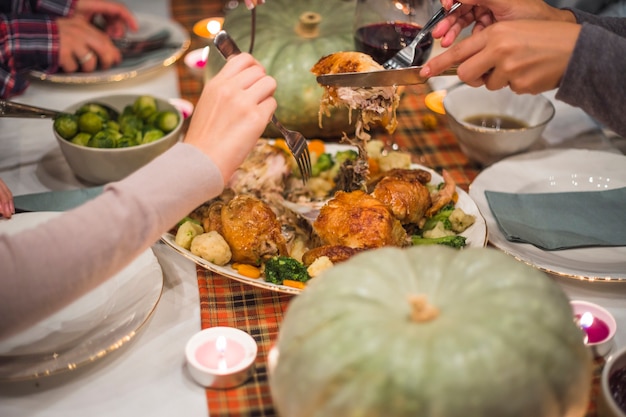 Free photo hands with forks taking meat