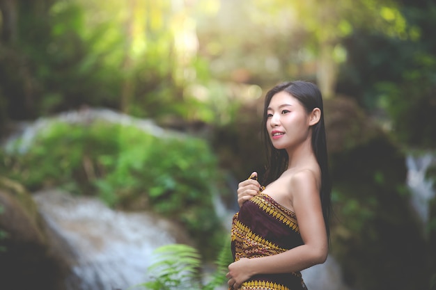 Free photo happy bathing women at the natural waterfall