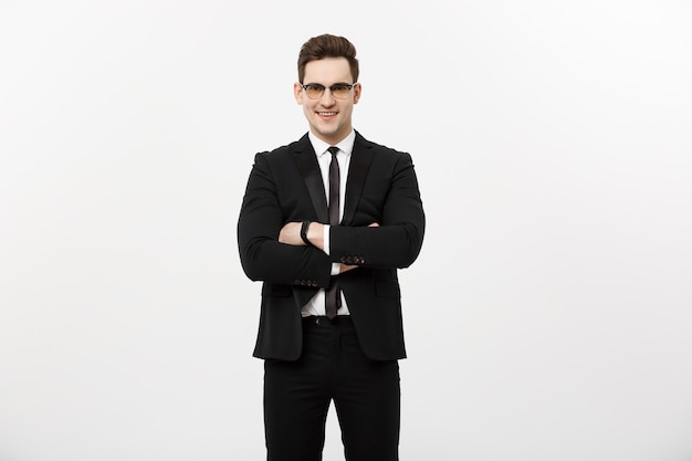 Free photo happy businessman isolated - successful handsome man standing with crossed arms isolated over white background.