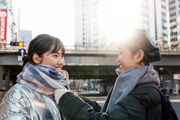 Free photo happy friends spending time together outside