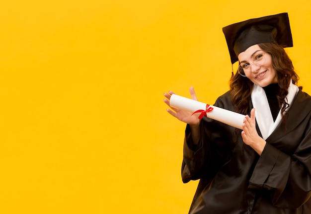 Happy woman holding certificate