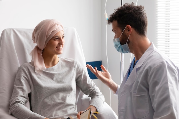 Free Photo health assistant taking care of a female patient