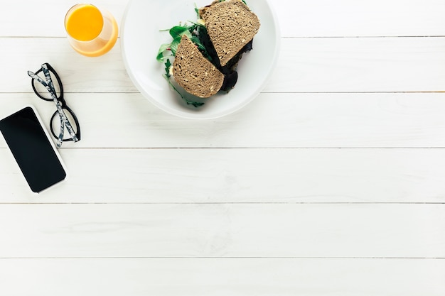 Free Photo healthy food composition with bread and orange juice