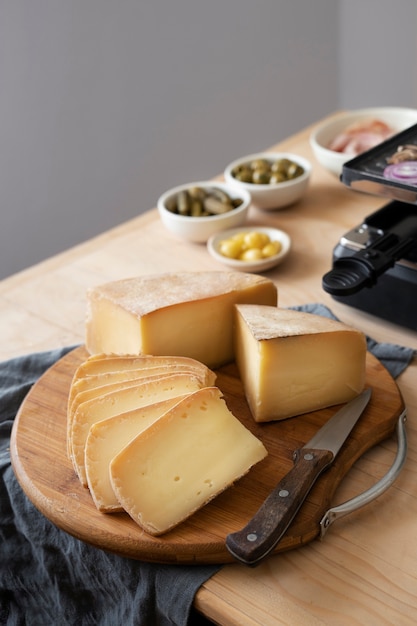 Free photo high angle delicious cheese on wooden board