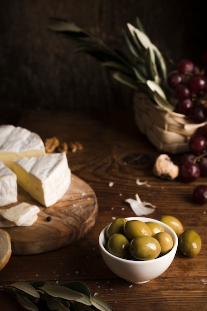 High angle olives and cheese composition on table