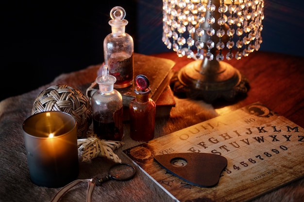 Free photo high angle ouija board and lamp