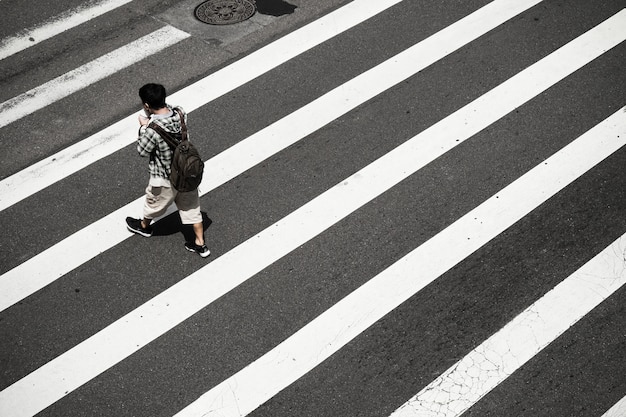 Free photo high angle of a person on crosswalk