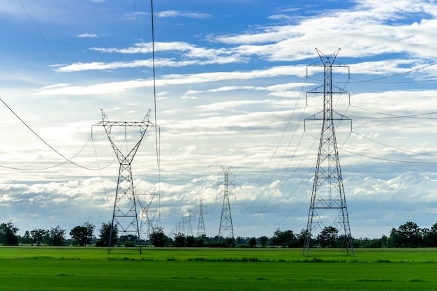 Free photo high voltage electric pole,high voltage power pole on blue sky