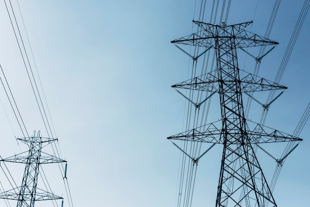 Free Photo high voltage power lines in the blue sky