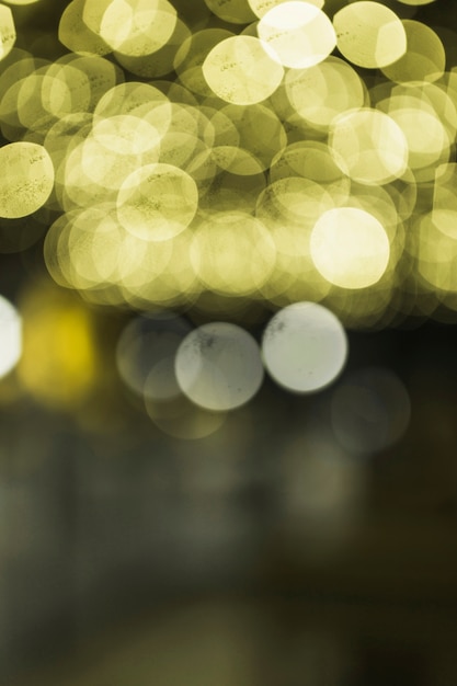 Free photo illuminated yellow transparent defocused background