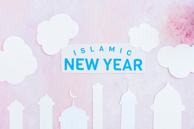 Free photo islamic new year paper in clouds over mosque