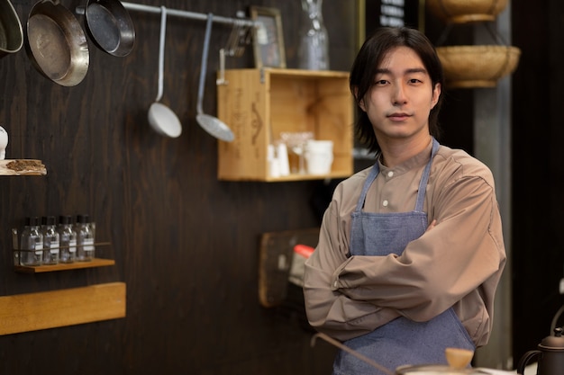 Japanese man posing in a restaurant