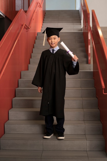 Free photo kid celebrating kindergarten graduation