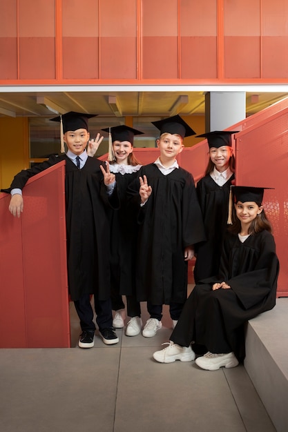 Free photo kids celebrating kindergarten graduation