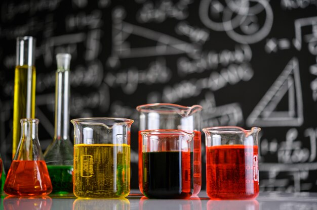 Laboratory glassware with liquids of different color