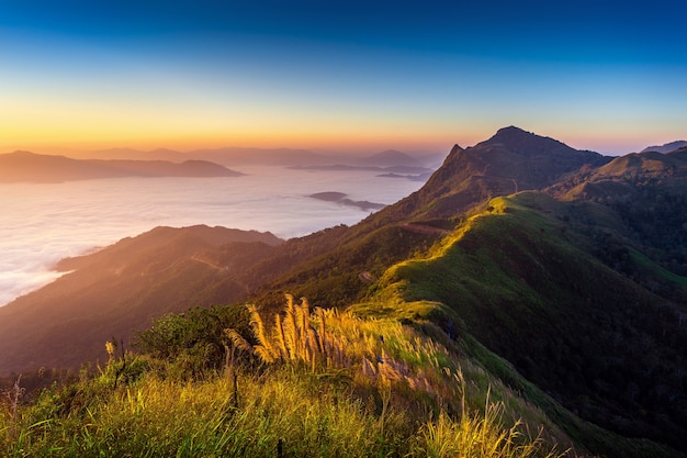 Free Photo landscape of morning fog and mountains at sunrise.