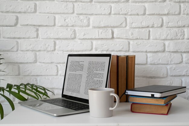 Laptop and books arrangement