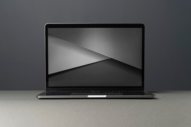 Free photo laptop device with minimalist monochrome background