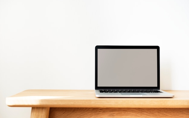 Free Photo laptop on a wooden table