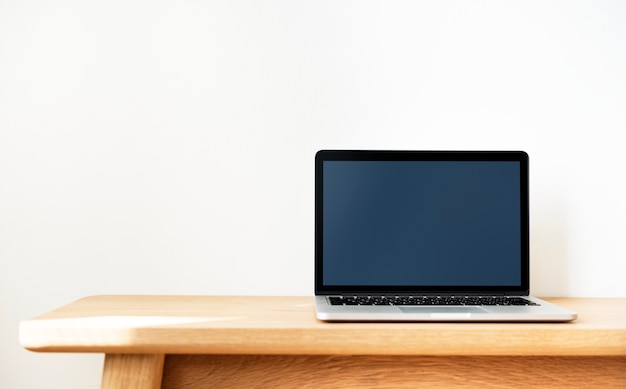 Laptop on a wooden table