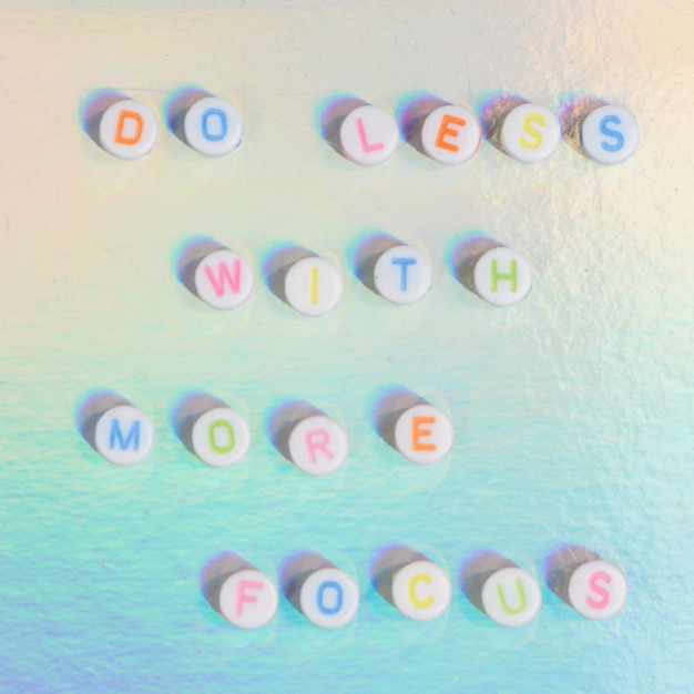 Free Photo do less with more focus beads text typography