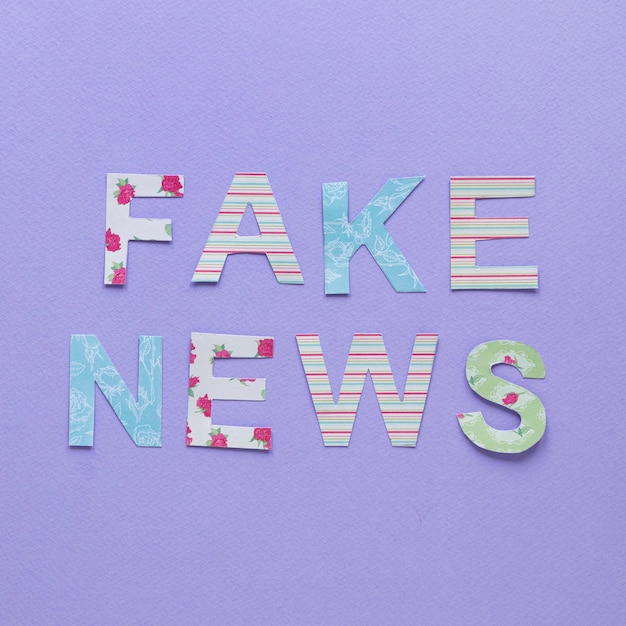 Free photo letters forming fake news message