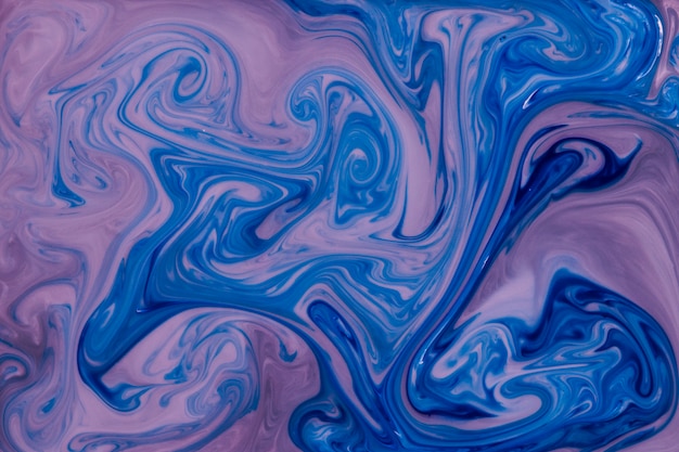 Free photo liquid marble abstract blue and pink background