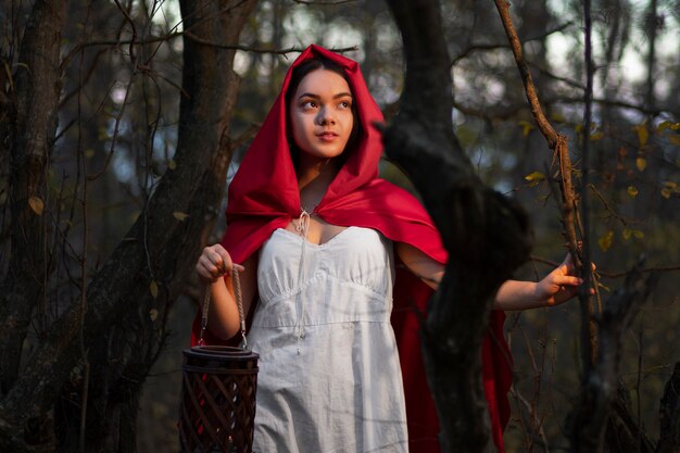 Little red riding hood in the forest portrait