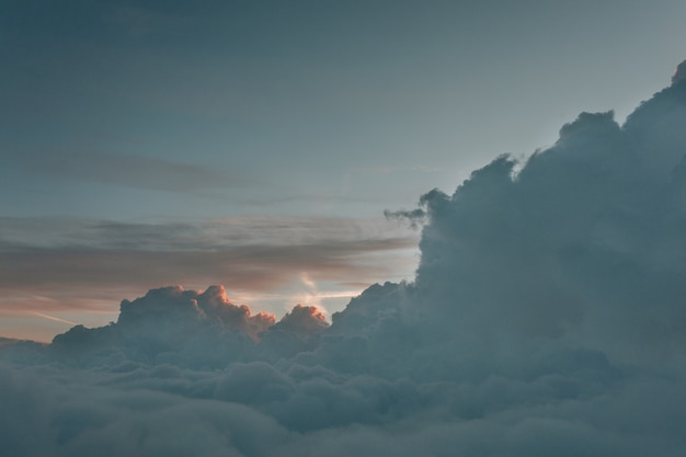 Free Photo long shot landscape of foggy clouds from above the sky