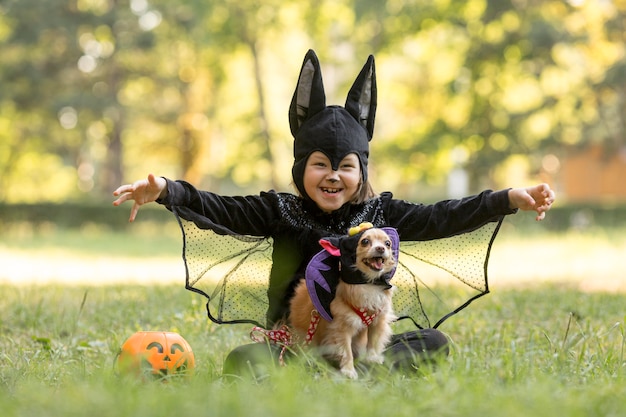 Free photo long shot of little boy in bat costume