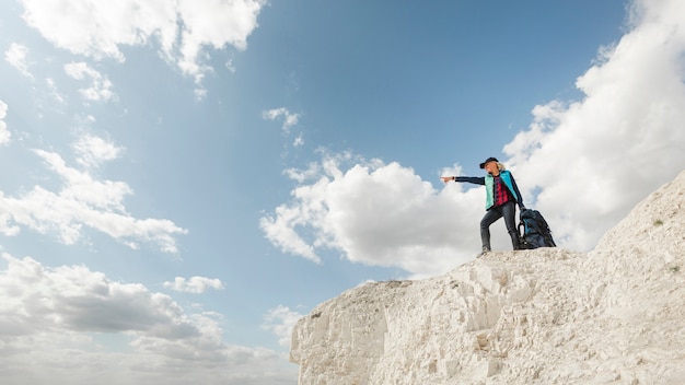 Free Photo long shot traveler on a mountain