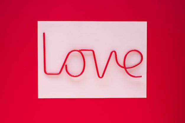 Free photo love inscription on light paper on table