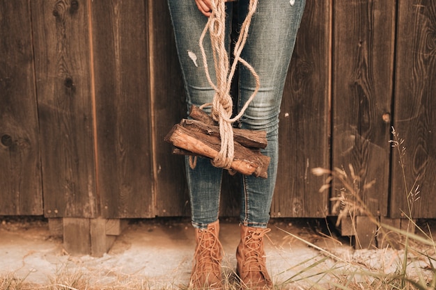 Free photo low view woman carring fire wood