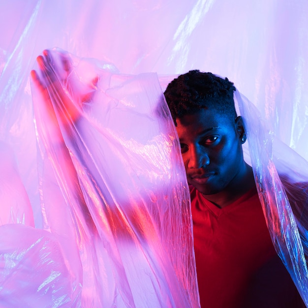 Man posing with plastic foil