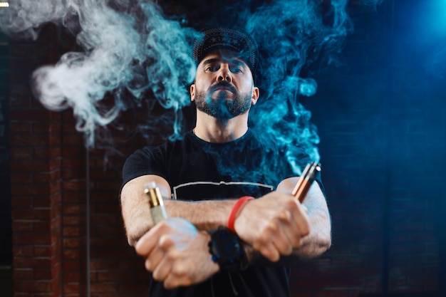 Free Photo man vaping an electronic cigarette