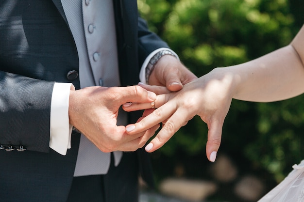 Free photo a man wears a wedding ring for his wife