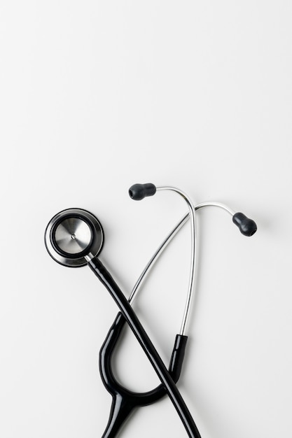 Medical stethoscope on a white surface