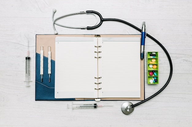 Free photo medical supplies around notepad