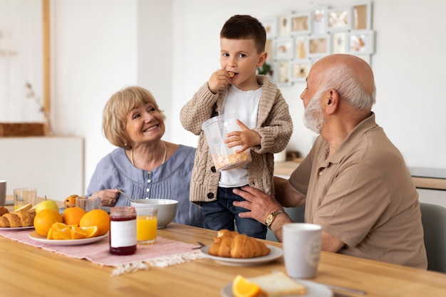 Free Photo medium shot grandparents and kid