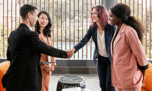 Free Photo medium shot man and woman shaking hands