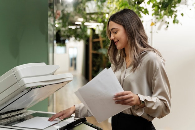 Free photo medium shot smiley woman holding paper